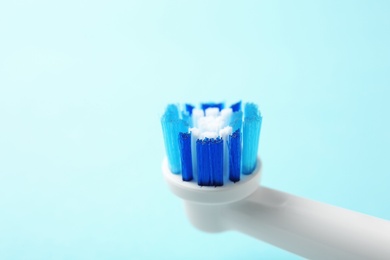 Photo of Electric toothbrush on color background, close up. Dental care