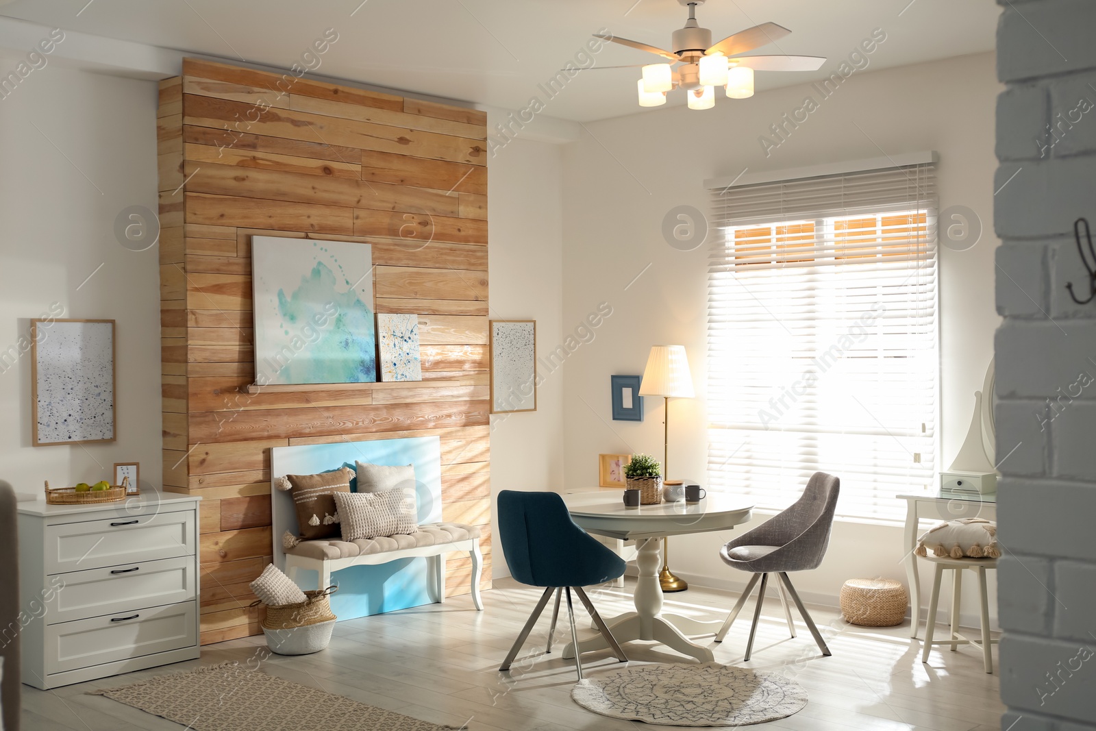 Photo of Stylish room interior with modern ceiling fan