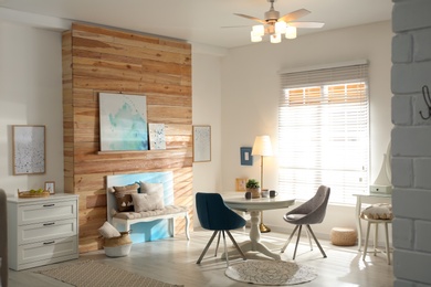 Photo of Stylish room interior with modern ceiling fan