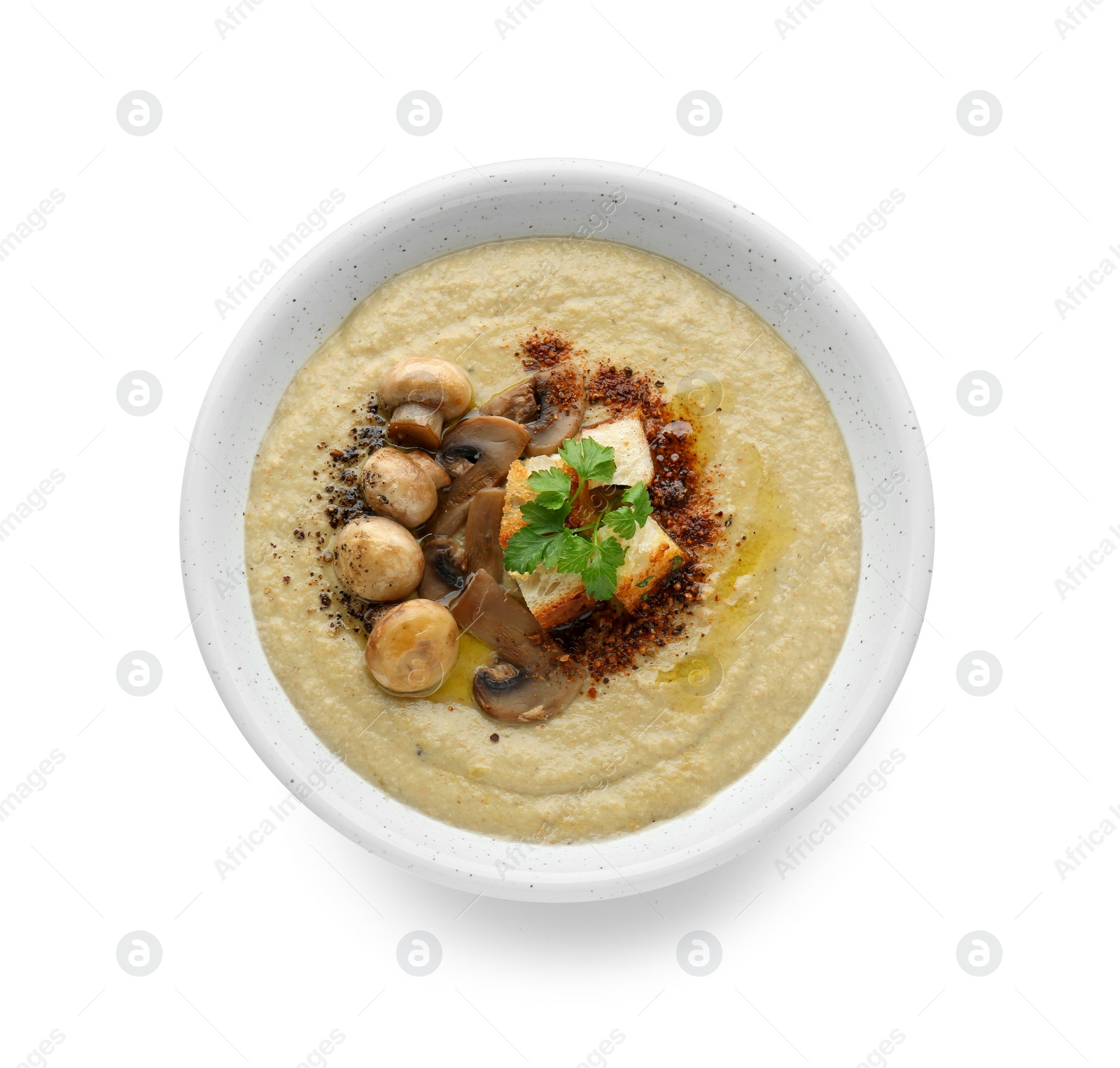 Photo of Delicious cream soup with mushrooms and croutons on white background, top view