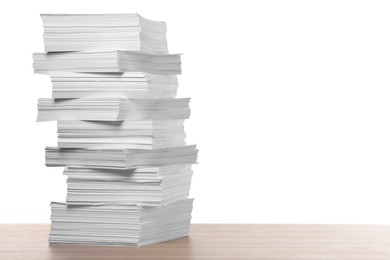 Stack of paper sheets on wooden table against white background. Space for text