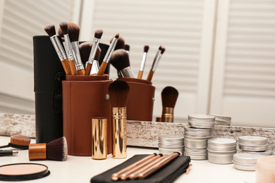 Photo of Professional makeup artists workplace with tools and cosmetic