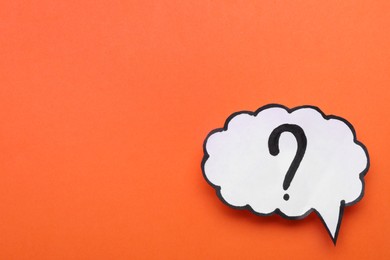 Photo of Paper speech bubble with question mark on orange background, top view. Space for text