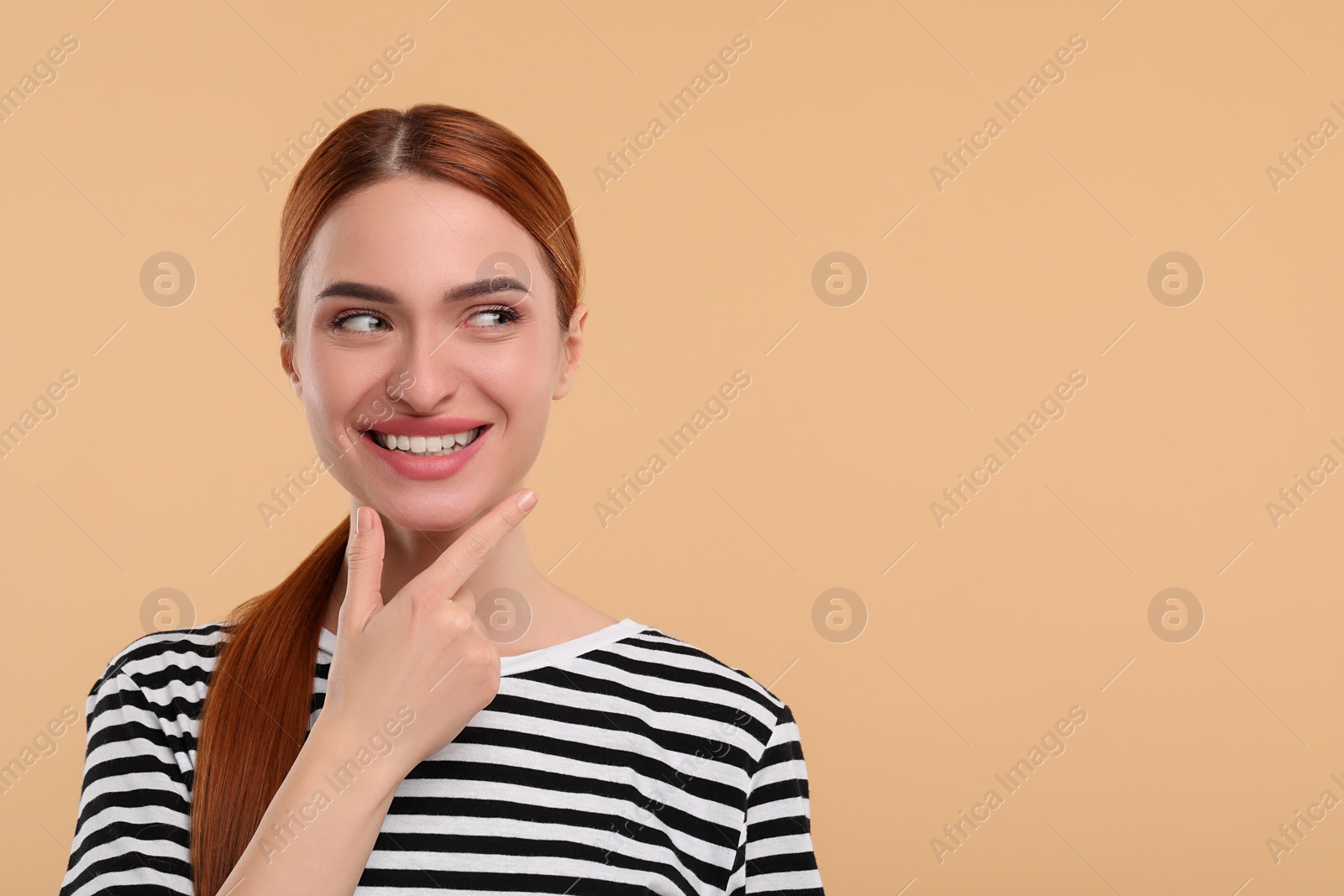 Photo of Beautiful woman with clean teeth smiling on beige background, space for text