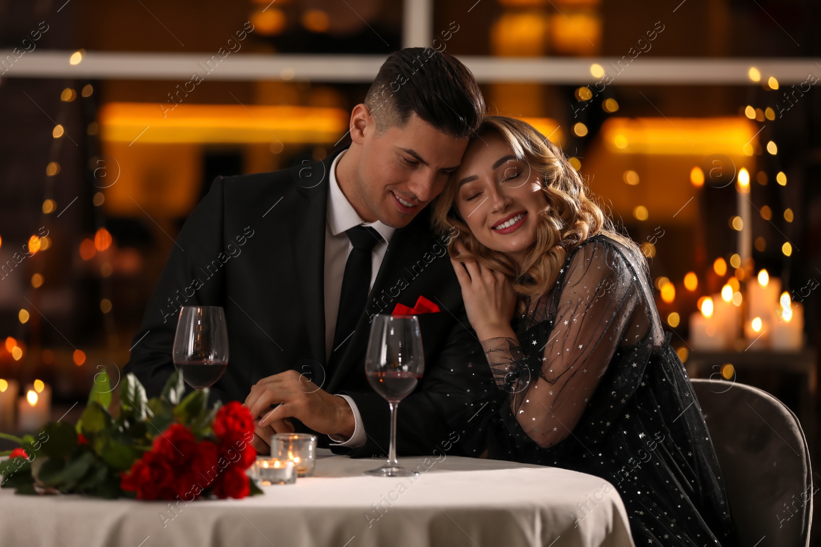 Photo of Lovely couple having romantic dinner on Valentine's day in restaurant