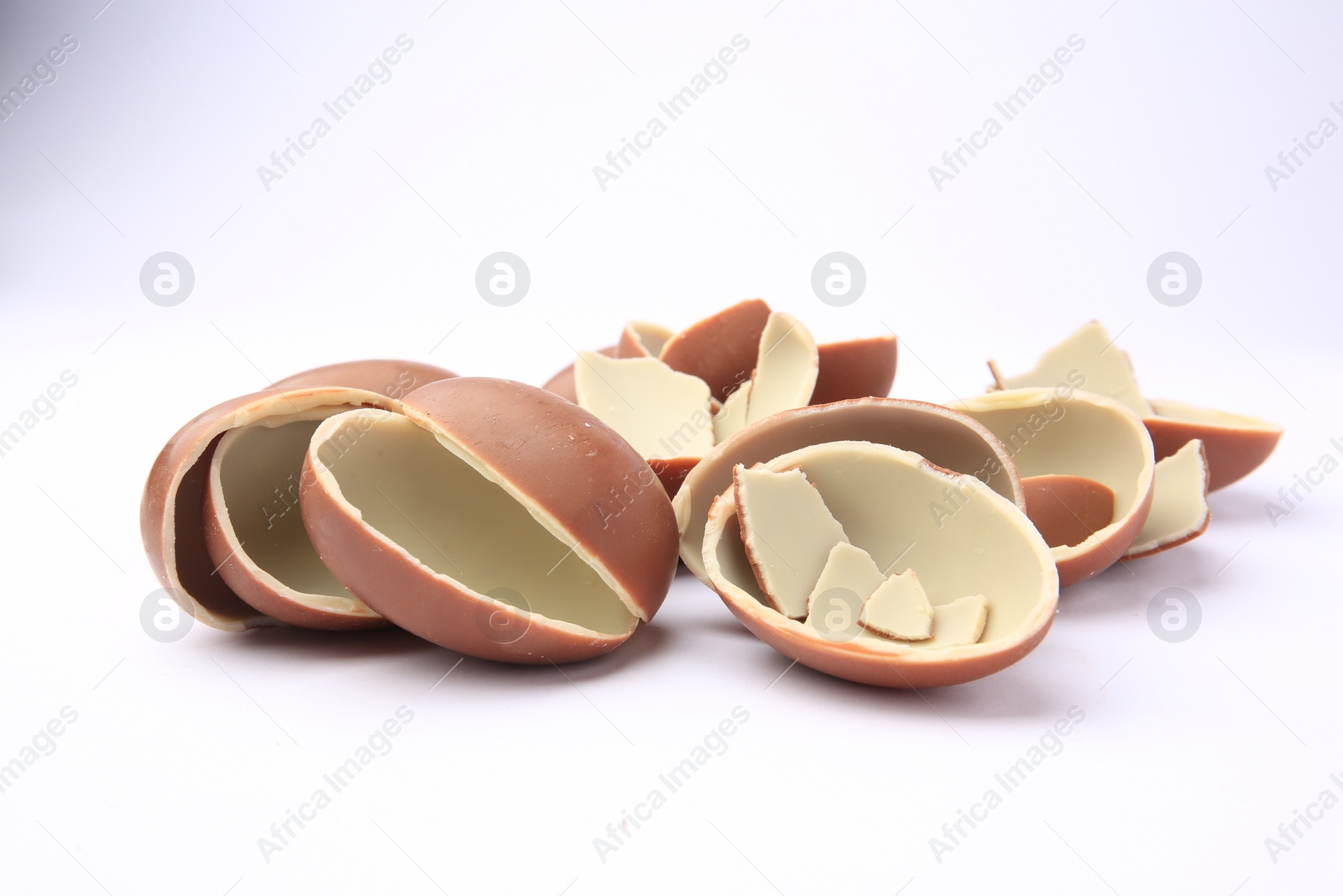 Photo of Sveti Vlas, Bulgaria - July 3, 2023: Broken halves of Kinder Surprise Eggs isolated on white