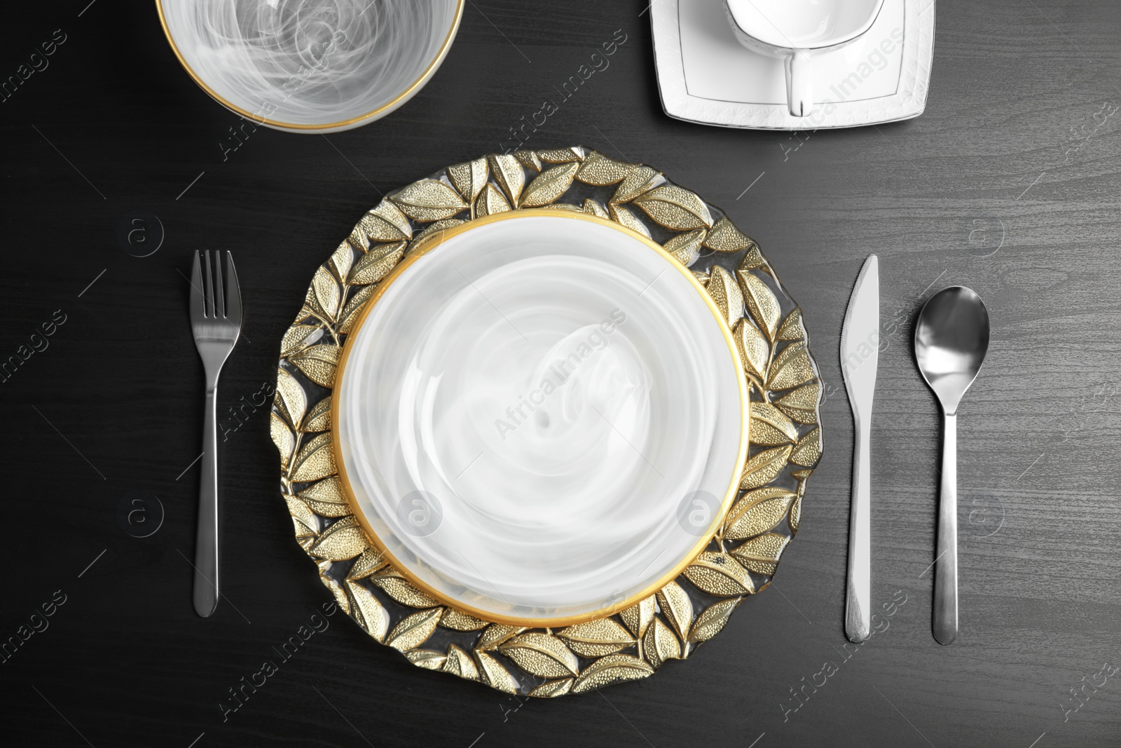 Photo of Elegant table setting on dark background, top view