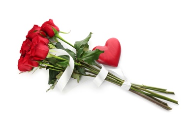 Beautiful red roses and heart on white background, top view. St. Valentine's day celebration