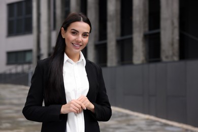 Photo of Portrait of smiling woman outdoors, space for text. Lawyer, businesswoman, accountant or manager