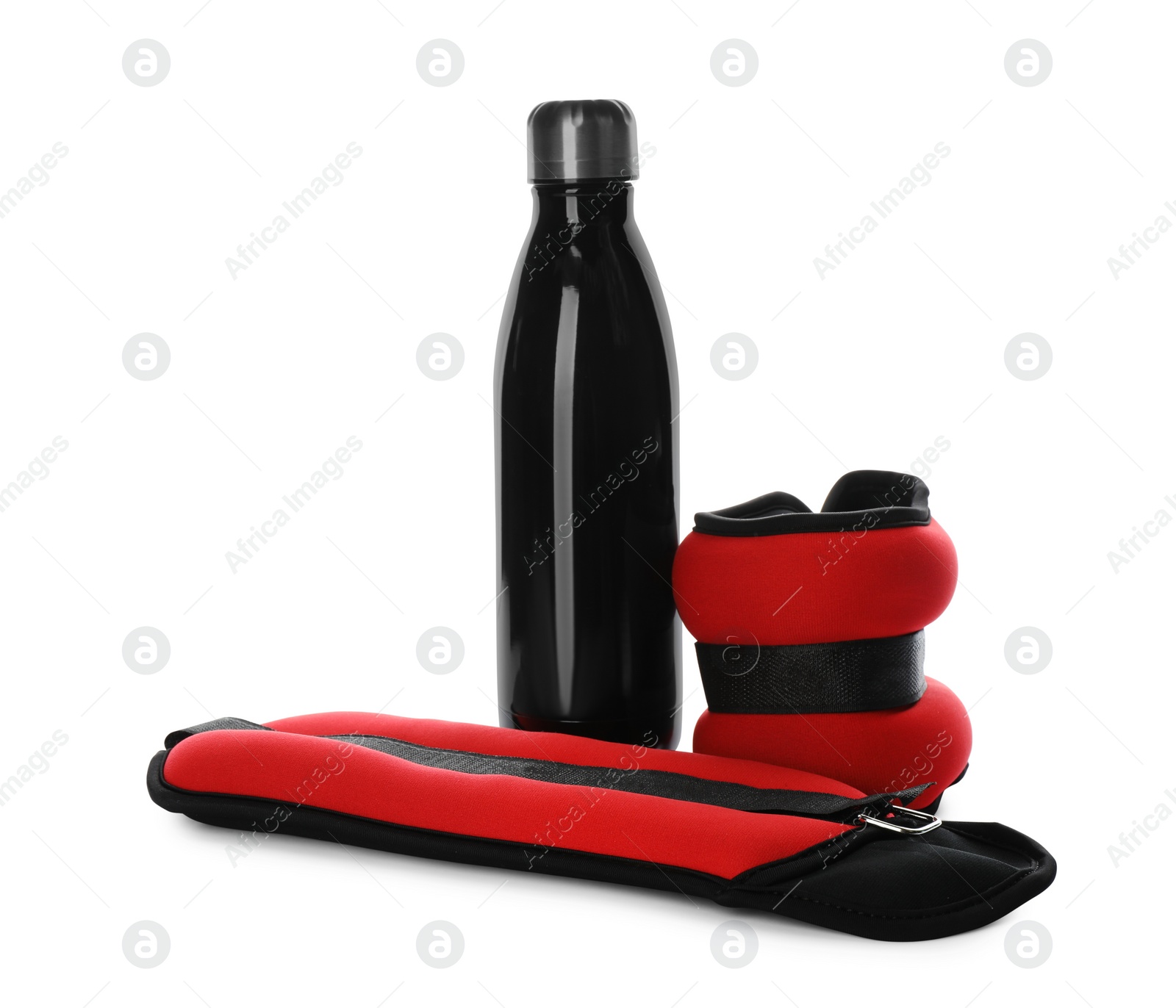 Photo of Stylish weighting agents and sport bottle on white background