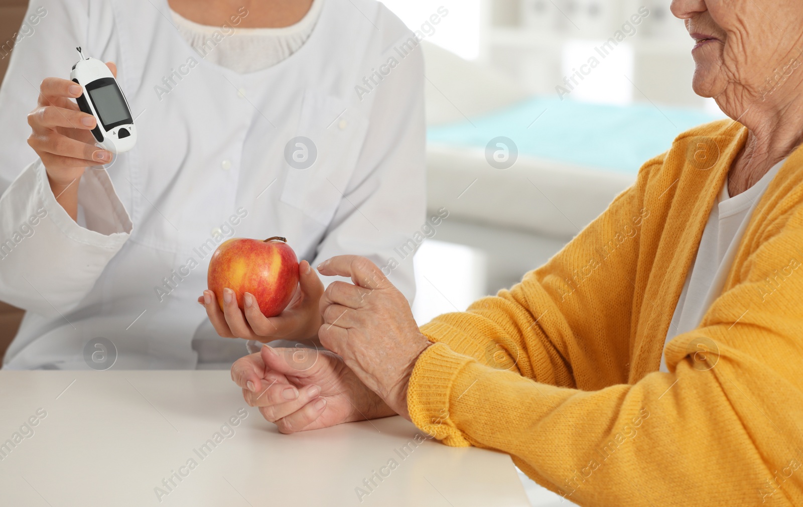 Photo of Senior woman visiting endocrinologist in clinic, closeup. Diabetes diet.