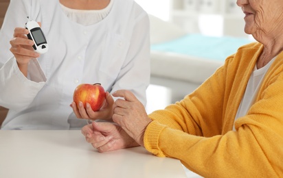 Senior woman visiting endocrinologist in clinic, closeup. Diabetes diet.