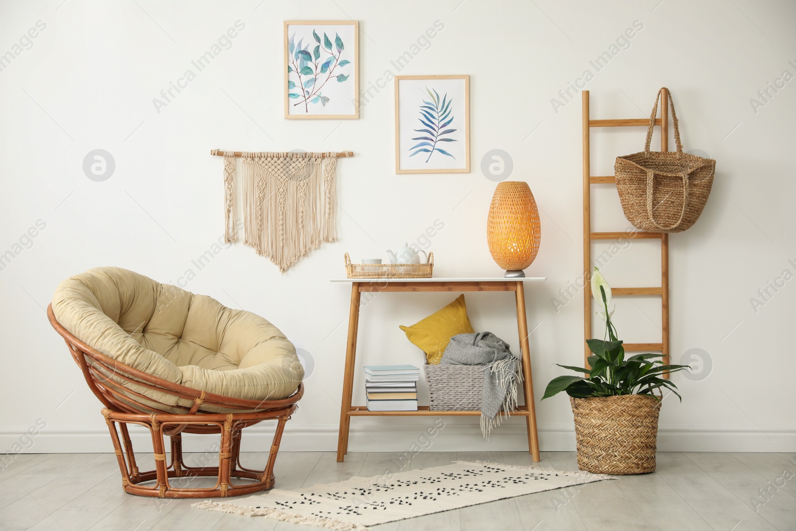 Photo of Living room interior design with comfortable papasan chair and wooden table