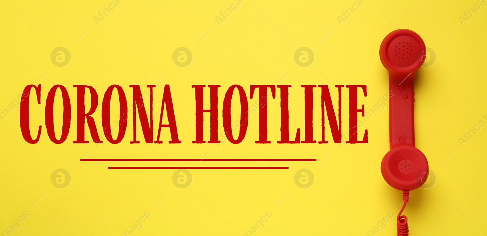 Image of Covid-19 Hotline. Red handset and text on yellow background, top view