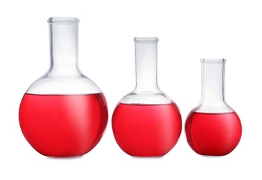 Florence flasks with red liquid on white background. Laboratory glassware