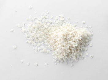 Photo of Raw rice flakes on white background. Healthy grains and cereals