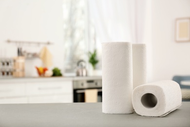 Rolls of paper towels on table in kitchen