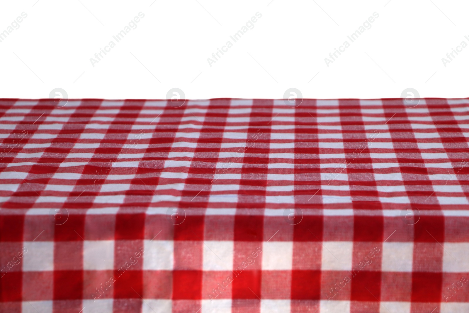 Photo of Table with checkered picnic cloth isolated on white