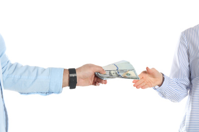 Photo of Man giving bribe money to woman on white background, closeup of hands