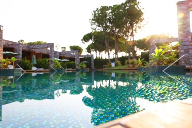 Outdoor swimming pool at resort, blurred view