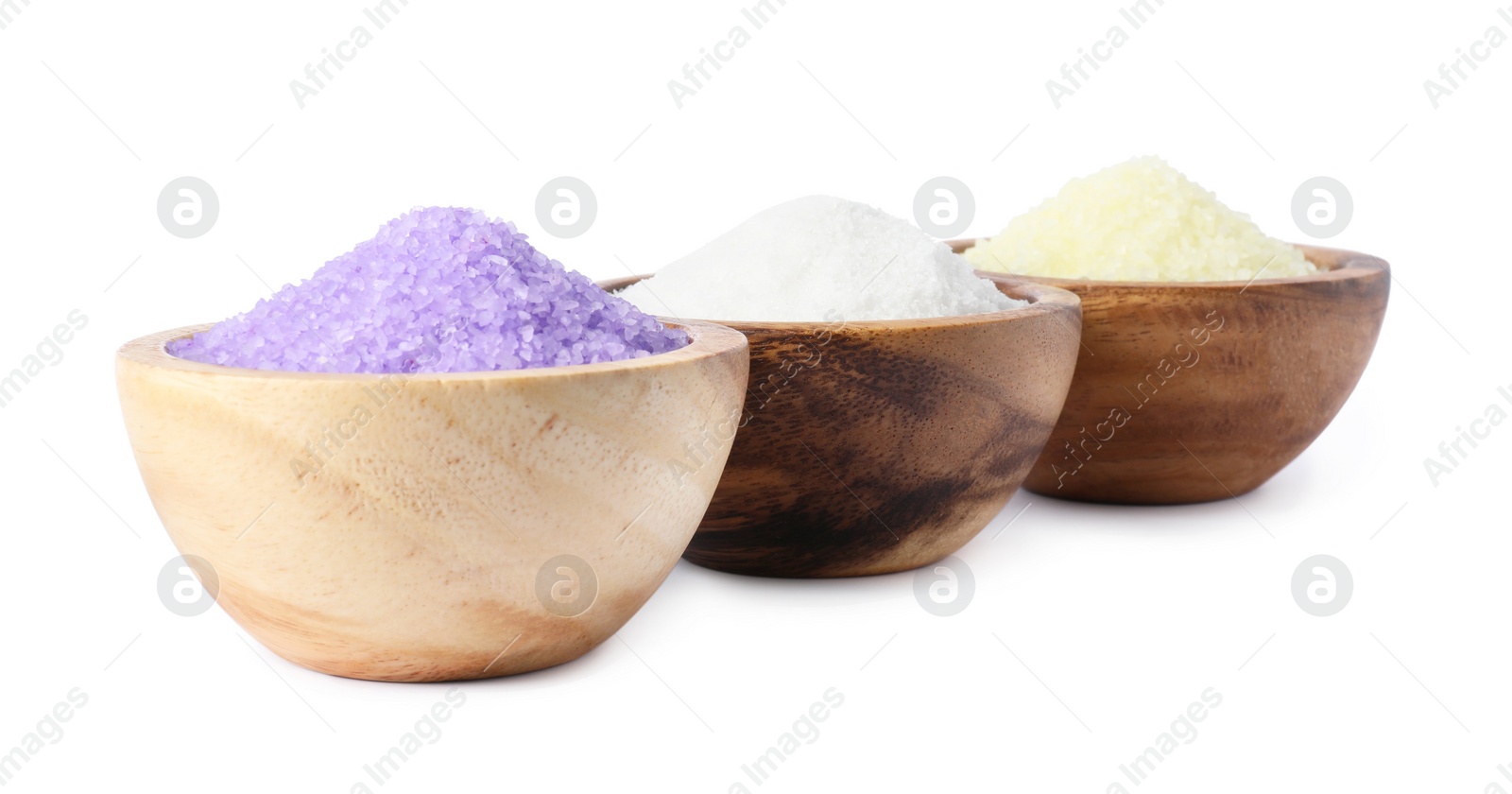 Photo of Wooden bowls with different sea salt on white background