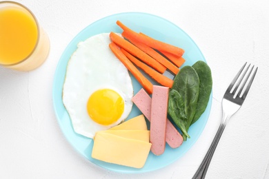 Flat lay composition with egg and cheese on white table. Breakfast for kids