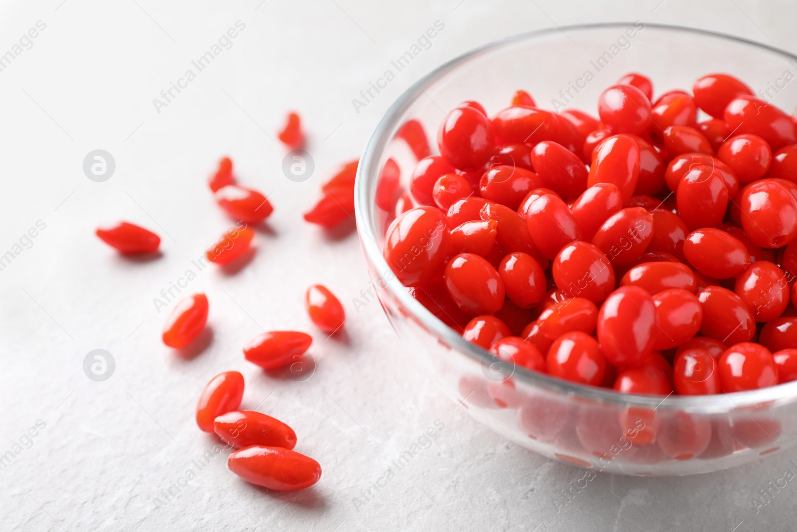 Photo of Fresh ripe goji berries on marble table