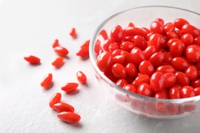 Photo of Fresh ripe goji berries on marble table