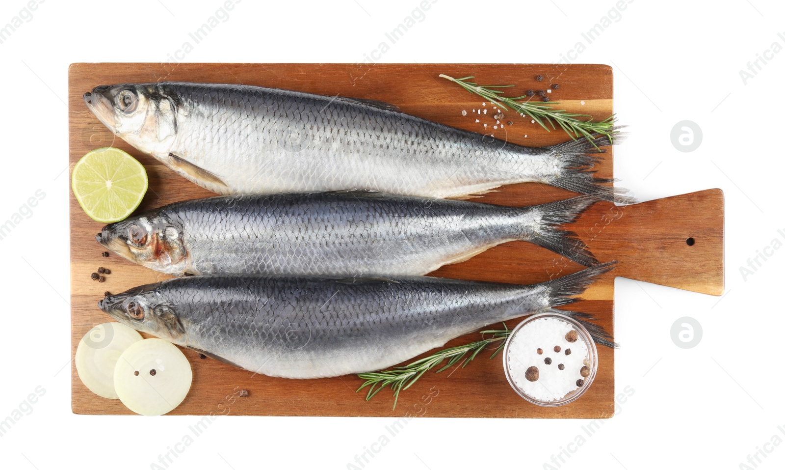 Photo of Wooden board with salted herrings, onion, lime, spices and rosemary isolated on white, top view