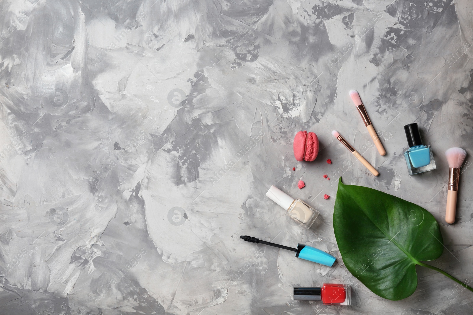 Photo of Flat lay composition with professional makeup products on grey background