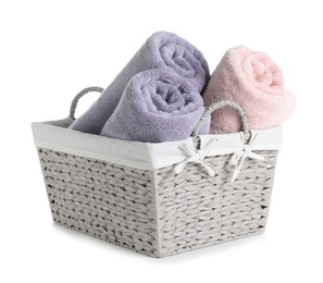 Basket with rolled towels isolated on white