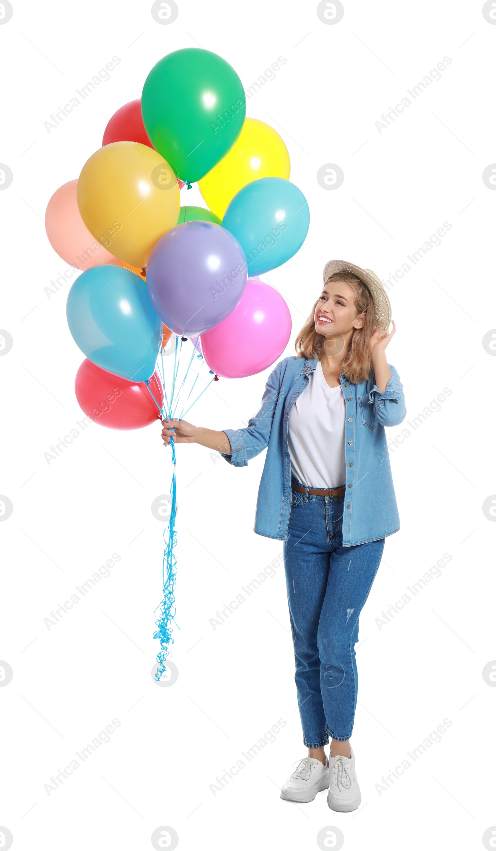 Photo of Young woman holding bunch of colorful balloons on white background