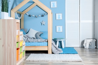 Comfortable bed in modern children room