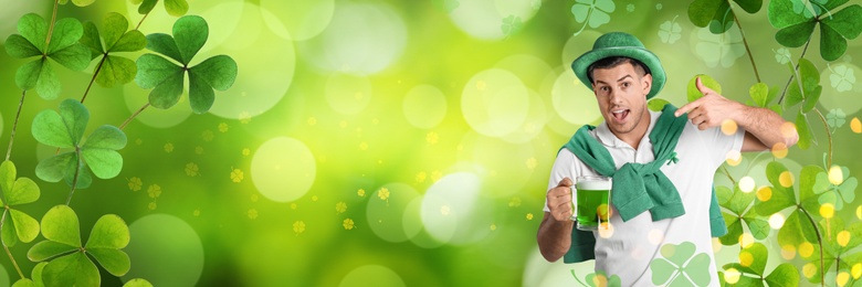 Image of Emotional man in St. Patrick's Day outfit with beer on green background, banner design. Space for text 