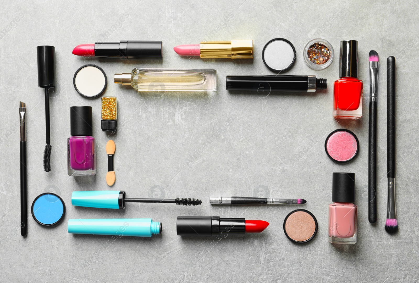 Photo of Flat lay composition with decorative cosmetics on gray background