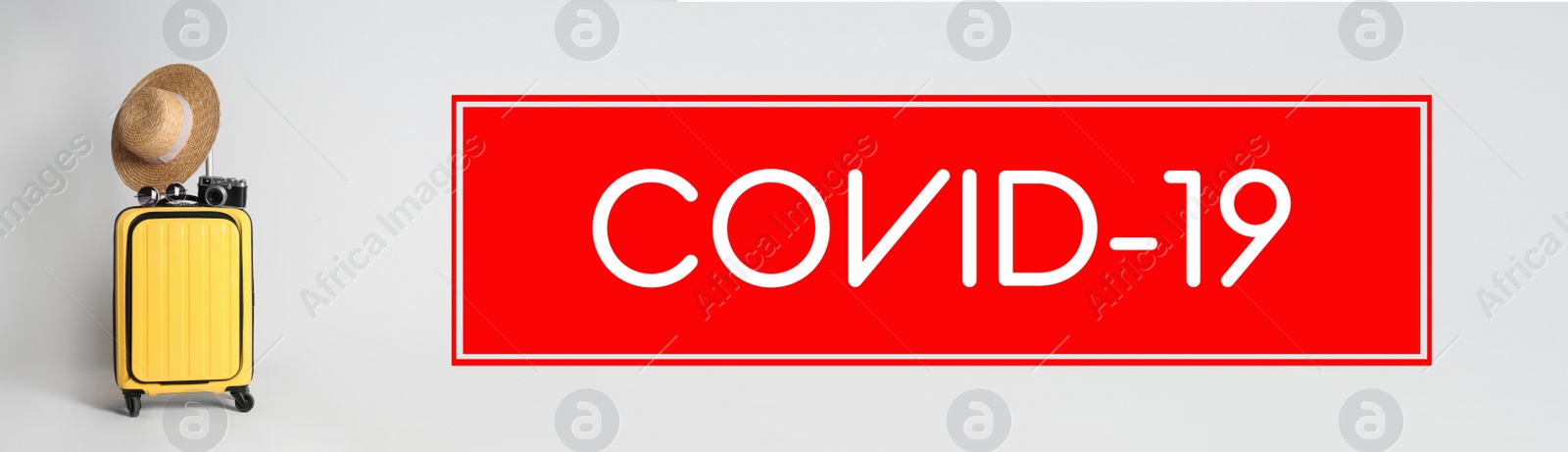 Image of Coronavirus pandemic, lockdown measures. Travel suitcase and text COVID-19 on light background, banner design