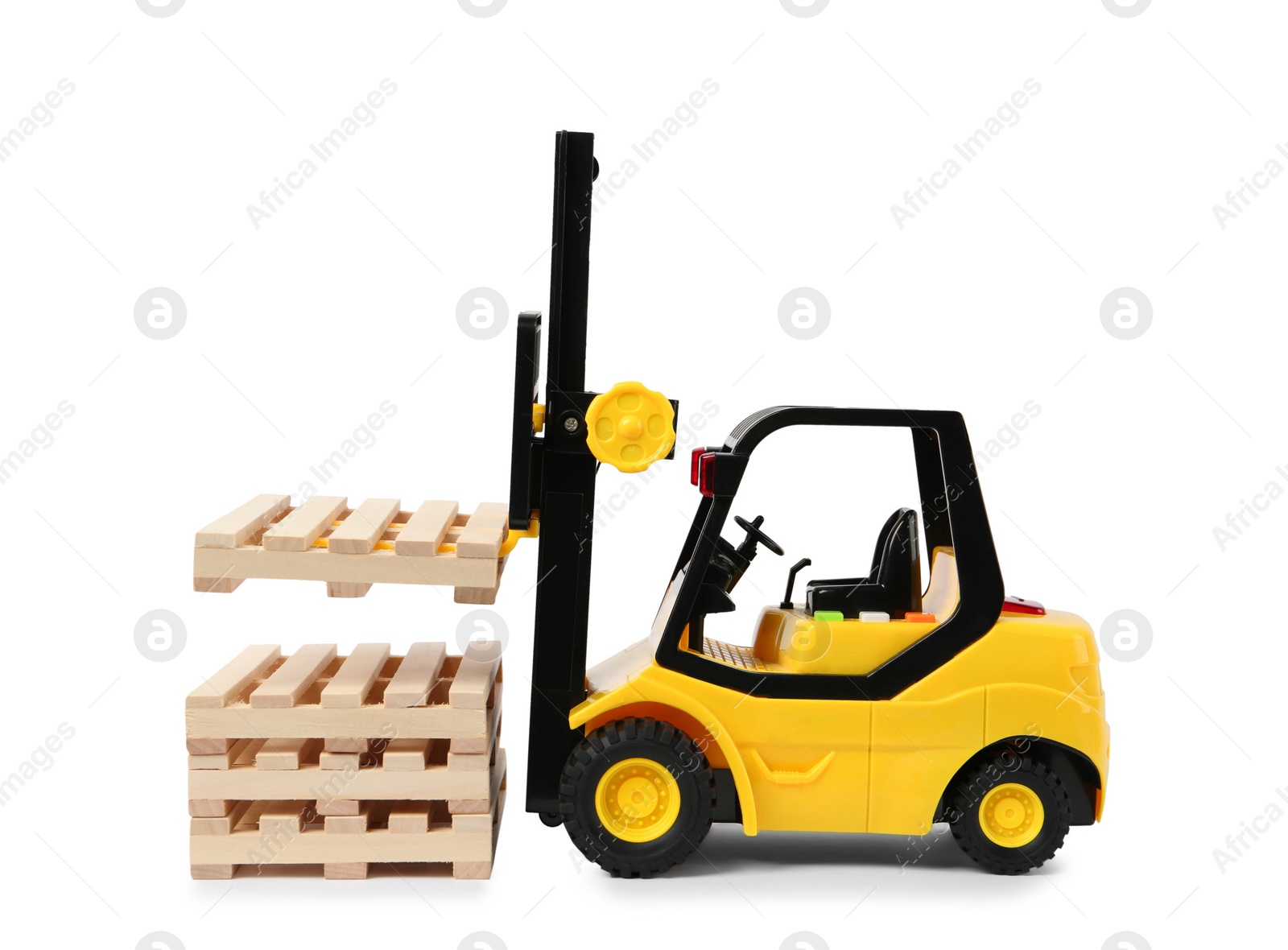 Photo of Toy forklift and wooden pallets on white background