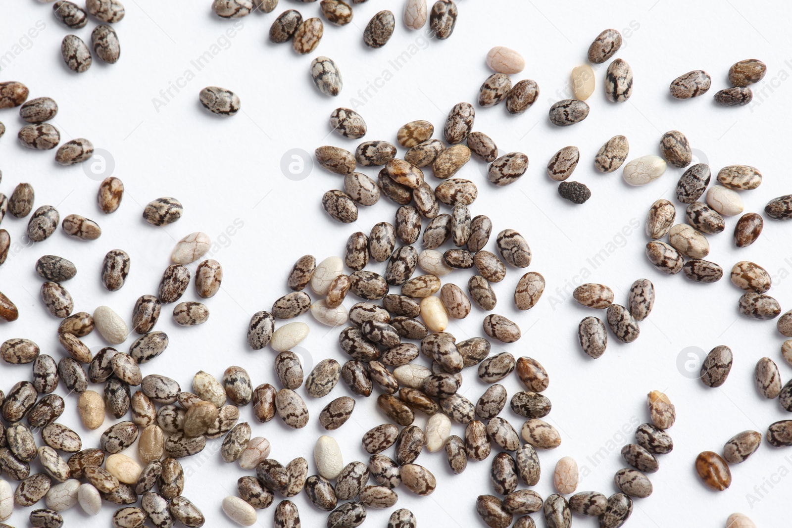 Photo of Chia seeds isolated on white, top view