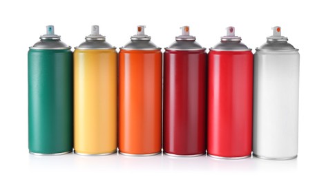 Photo of Many spray paint cans isolated on white