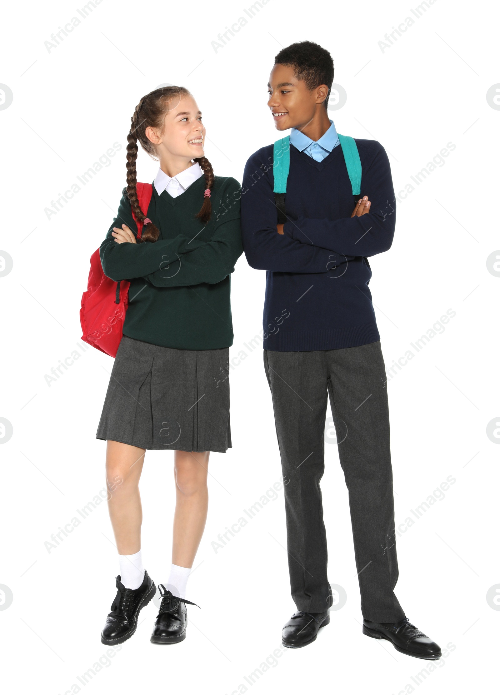 Photo of Teenagers in stylish school uniform on white background