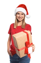 Young woman with Christmas gift on white background