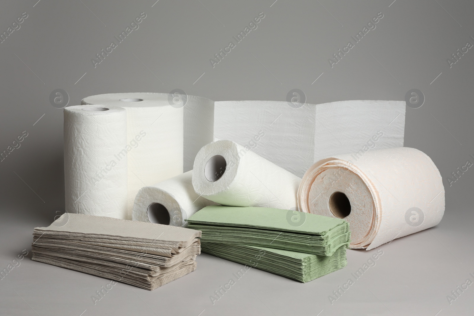 Photo of Paper towels and napkins on grey background