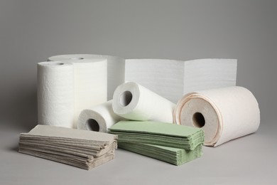 Paper towels and napkins on grey background