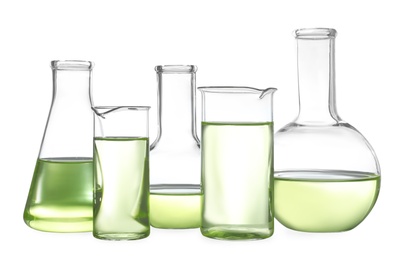Photo of Glassware with liquids isolated on white. Laboratory analysis