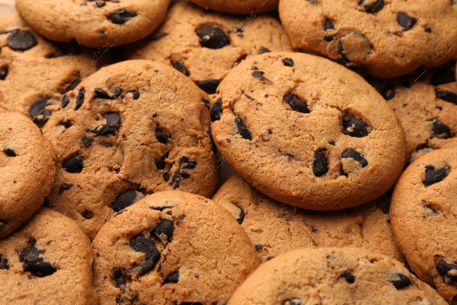 Delicious chocolate chip cookies as background, closeup Photo of Delicious chocolate chip cookies as background, closeup