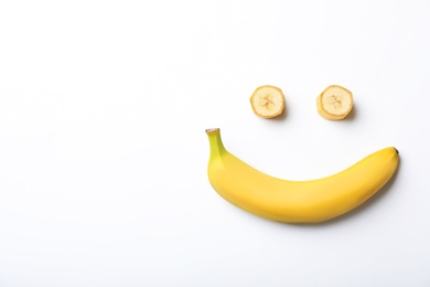 Photo of Funny flat lay composition with bananas on white background
