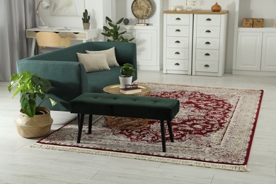 Photo of Stylish living room with beautiful carpet and furniture. Interior design