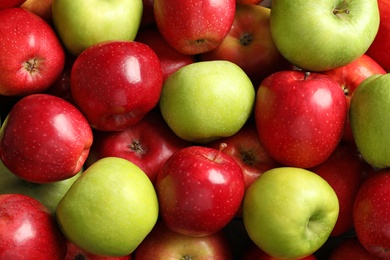 Photo of Fresh red and green apples as background
