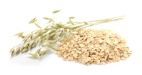 Photo of Oatmeal and branches with florets isolated on white