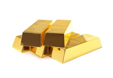 Photo of Precious shiny gold bars on white background